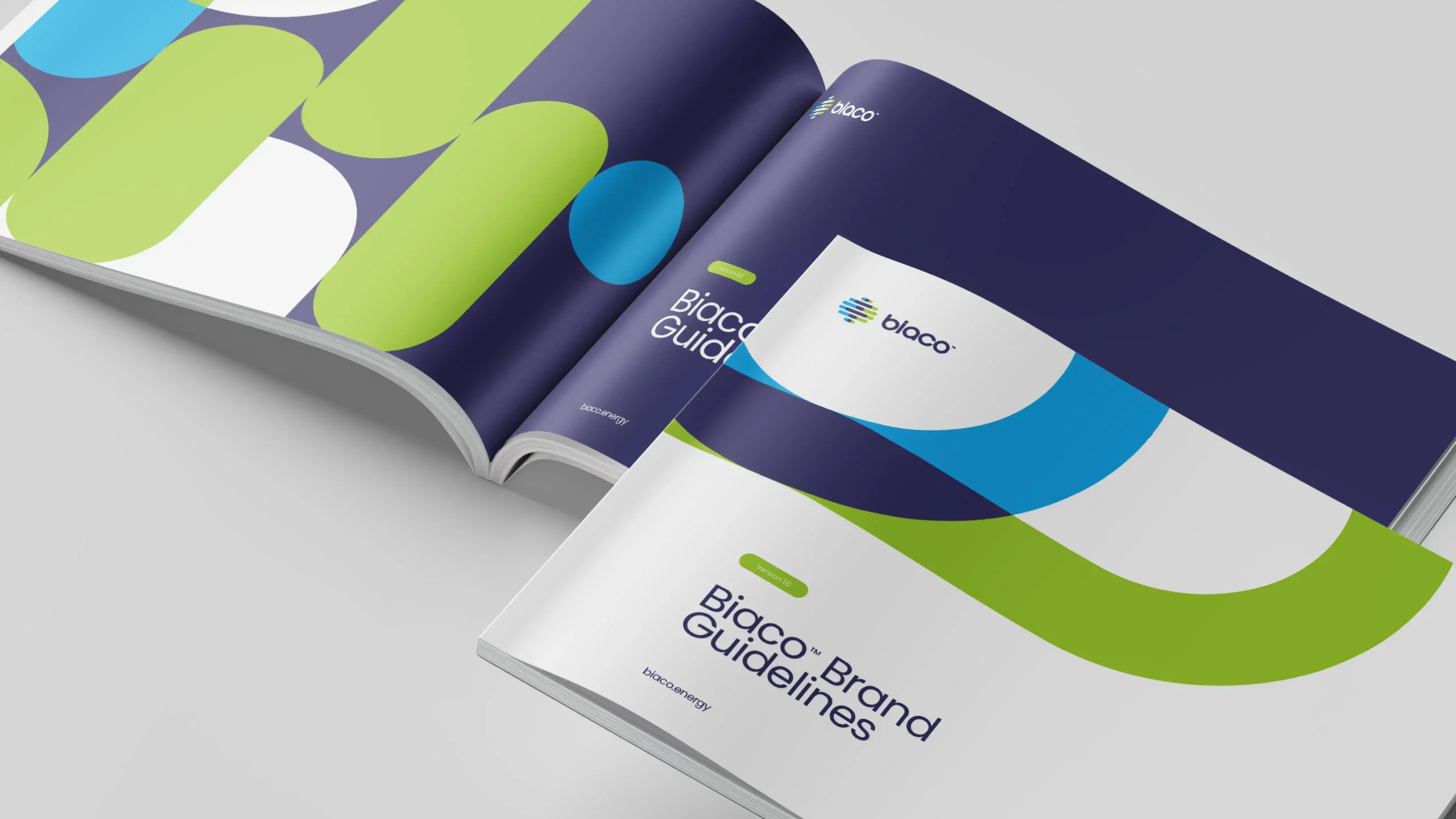 Open brand guideline book with Biaco’s colour and shape system.