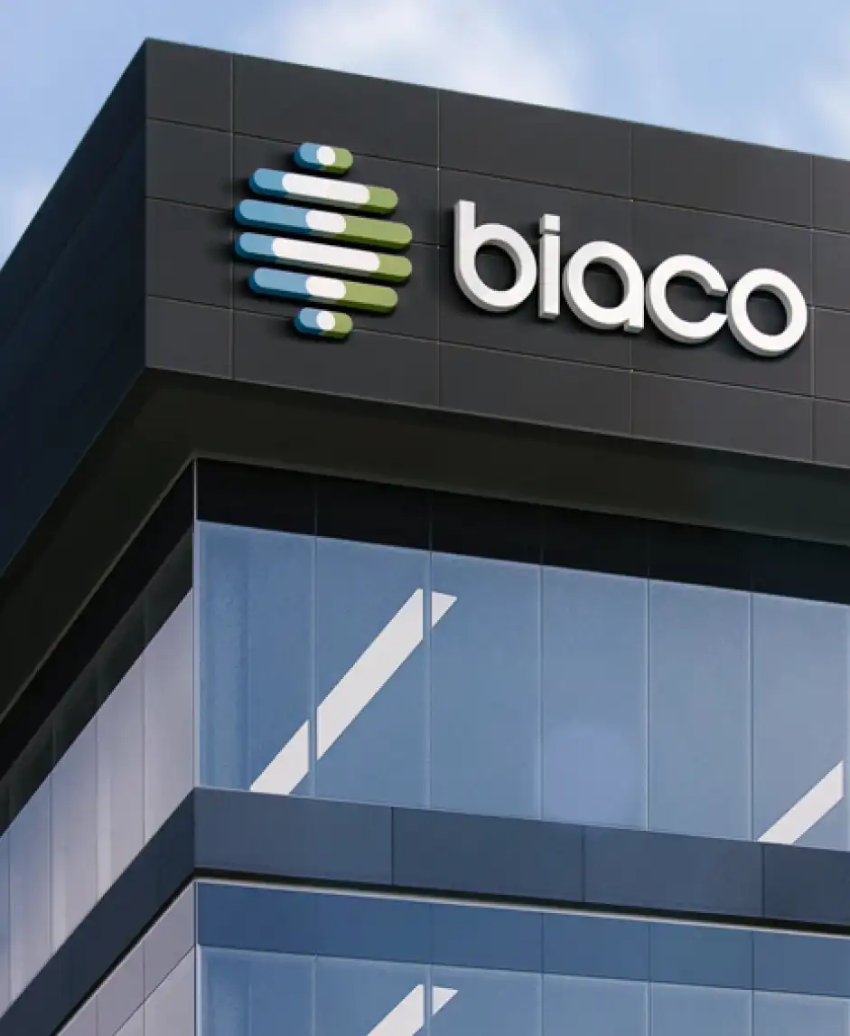 3D Biaco symbol and wordmark on a modern building facade.